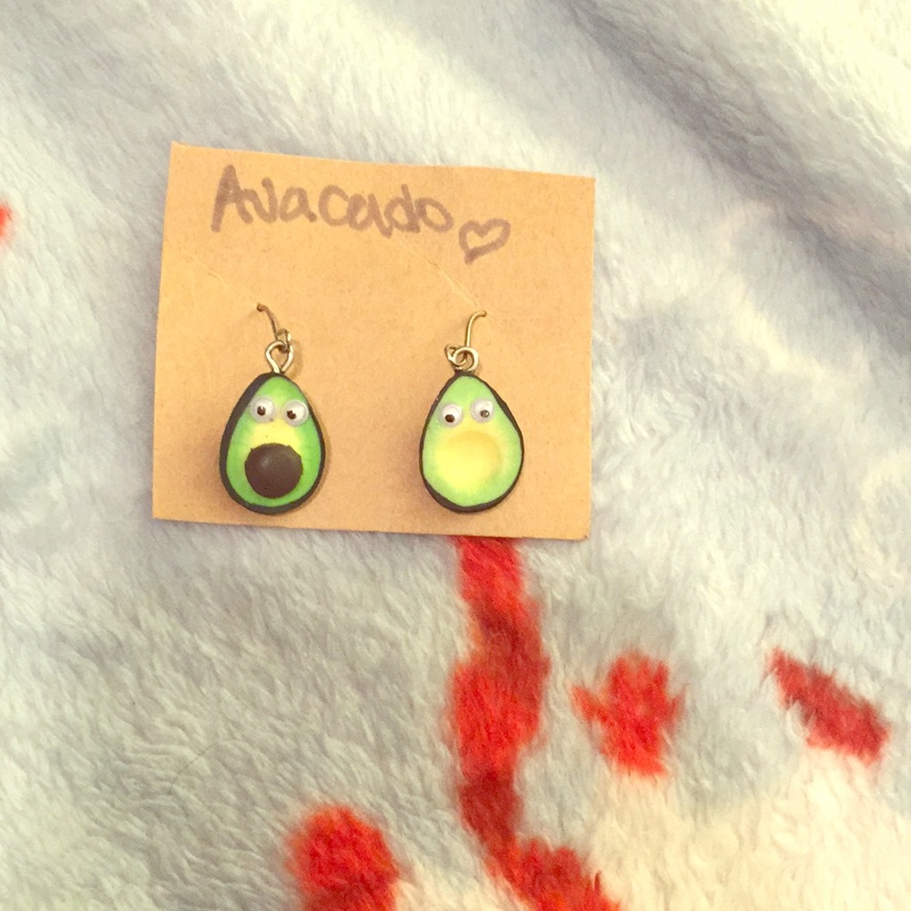 Two avocado slice goggley eyes earrings